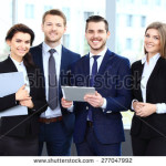 stock-photo-happy-smiling-business-team-in-office-277047992